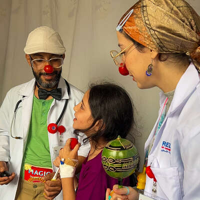 September 2023- Our healthcare clowns are singing with a hospitalised child during a paediatric visit to Palestine Medical Complex in Ramallah.